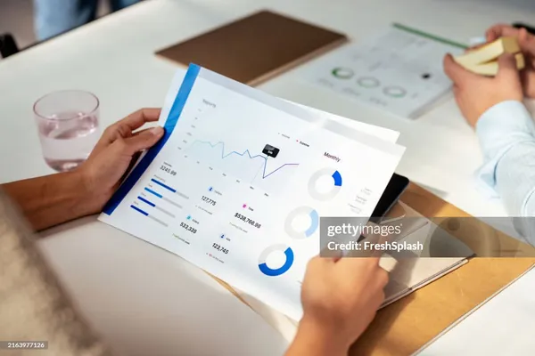 Business meeting reviewing financial documents and reports